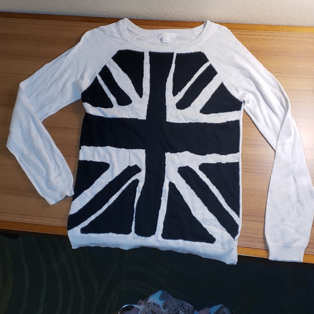 Stylish new black & white sweater. Name brand